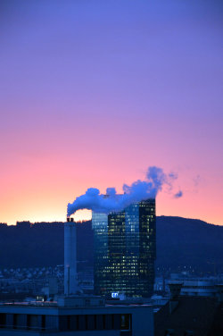 A picture of the ERZ power plant chimney and of the Prime Tower, both in Zurich (Switzerland)