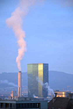 A picture of the ERZ power plant chimney and of the Prime Tower, both in Zurich (Switzerland)