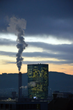 A picture of the ERZ power plant chimney and of the Prime Tower, both in Zurich (Switzerland)