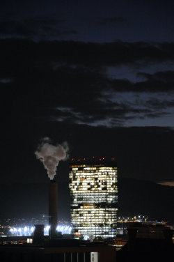 A picture of the ERZ power plant chimney and of the Prime Tower, both in Zurich (Switzerland)